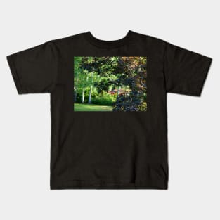 Red car hiding in the trees Kids T-Shirt